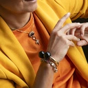 Sztywna, złota bransoletka zdobiona czarnymi kulami. CHANEL TO MAŁO