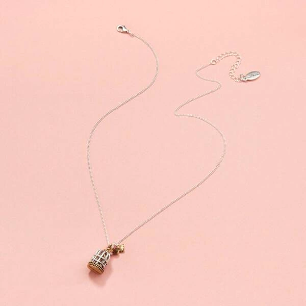 Krótki srebrno-złoty wisiorek z klatką z ptaszkiem. FRASZKA