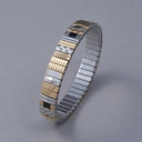 Bransoletka z inkrustowanych i pozłacanych ogniw ze stali. RUE DE RIVOLI