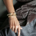 Krótki pozłacany naszyjnik z szarymi kryształami. MARTINI