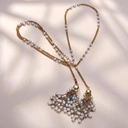 Długi złocony naszyjnik na łańcuszku z perełkami. PUREZZA