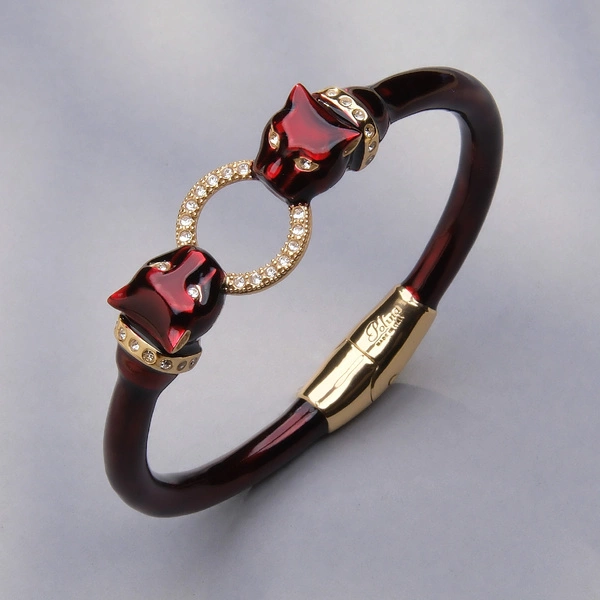 Pozłacana bransoletka z głowami panter z ringiem. VERONICA