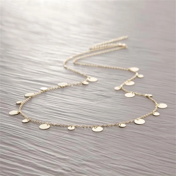 Długi pozłacany naszyjnik z okrągłymi zawieszkami. ZŁOTY SZELEST