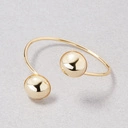 Sztywna pozłacana bransoletka z dwiema półkulami. DWIE POŁÓWKI