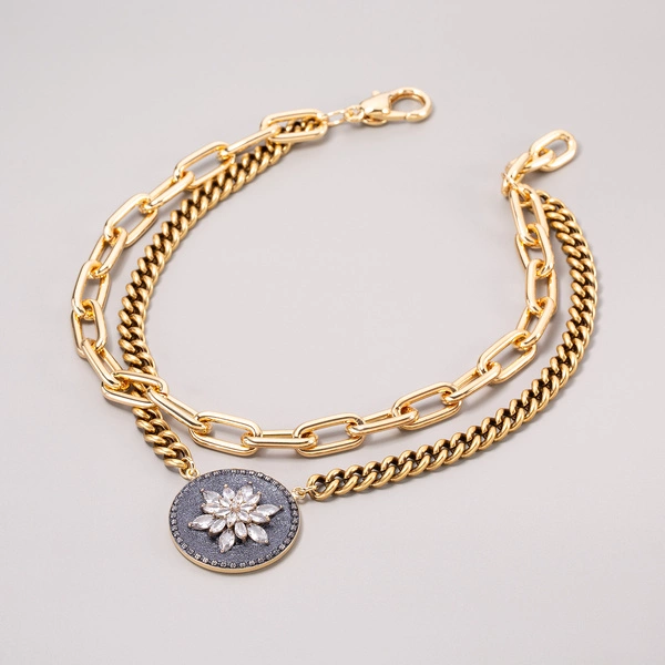 Pozłacany wisior z zawieszką z kwiatem z cyrkonii. ROZKWIT ŚWIATŁA