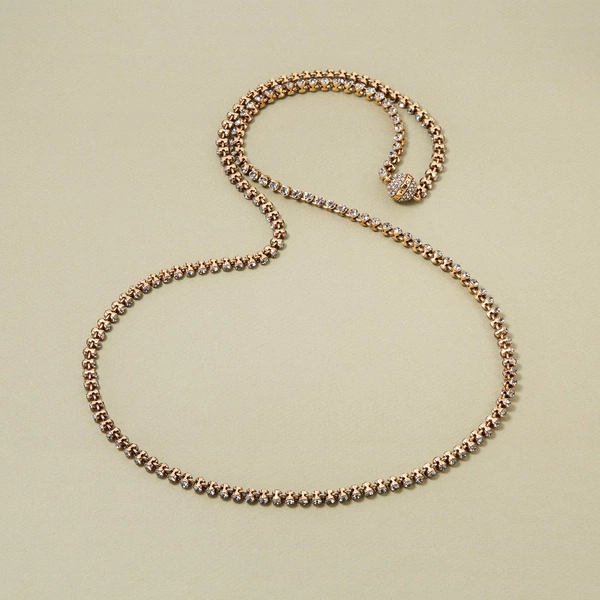 Długi pozłacany naszyjnik z kryształami i ozdobną kulką. OD RANA PO WIECZÓR