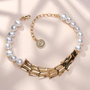 Złocony naszyjnik z pereł z teksturowanym dekorem. JEANNE