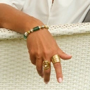 Szeroki pozłacany pierścionek z dziewięciu obrączek. FABRYKA SNÓW