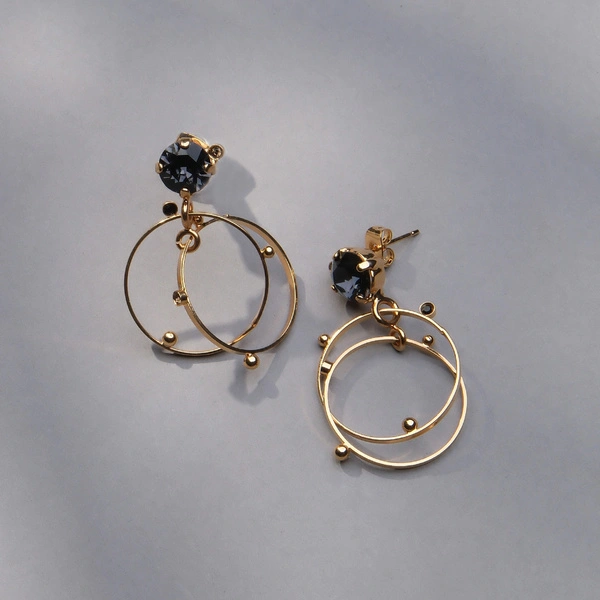 Pozłącane kolczyki koła z granatowym kryształem. GALAKTYCZNY GRANAT