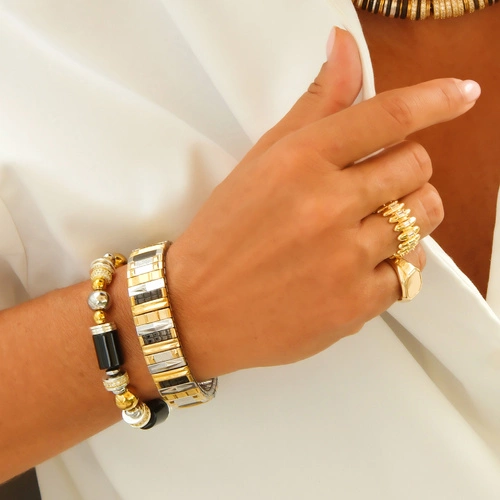 Bransoletka z inkrustowanych i pozłacanych ogniw ze stali. CITE PICASSO