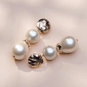 Złocone kolczyki z motywem liści i perłami bawełnianymi. DO JUTRA W CANNES