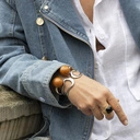 Złota sztywna bransoletka z kulkami w kolorze sieny. BRAZYLIJSKIE TRUFLE