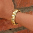 Bransoletka z inkrustowanych i pozłacanych ogniw ze stali. AVENUE MONTAIGNE