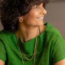 Drobne pozłacane kolczyki w kształcie zamkniętych kółek. PUELLA