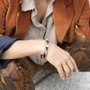 Złota bransoletka z ekoskórą z włosiem à la zebra. SŁOŃCE AFRYKI