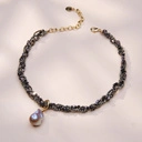 Elegancki złocony naszyjnik z hematytami i barokową perłą. NOVA ICARIA