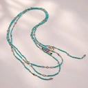 Naszyjnik z błękitnych spineli z kryształkami i zawieszkami. TURKUSOWE FALE