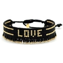 Bransoletka z czarnych paciorków Miyuki ze złotym napisem. CZUŁOŚCI W CIEMNOŚCI