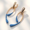 Pozłacane kolczyki z końcami emaliowanymi na niebiesko. DZIEWIĄTE WROTA