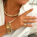 Krótki naszyjnik z pozłacanymi i posrebrzanymi krążkami. GRANDE ROUE