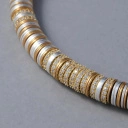 Krótki naszyjnik z pozłacanymi i posrebrzanymi krążkami. GRANDE ROUE