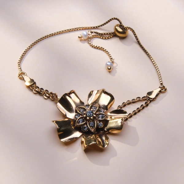 Złocona bransoletka z kwiatem z czarnymi kryształkami. CZARNY KWIAT