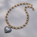 Pozłacany wisior z czarnym sercem z motylkiem z cyrkonii. NIE DLA WSZYSTKICH