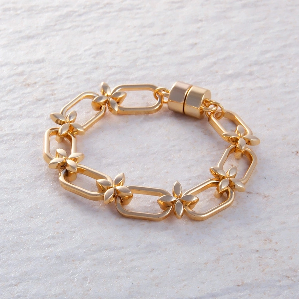 Pozłacana bransoletka z ogniw połączonych kwiatami. OGRODY BOTANICO