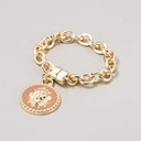 Pozłacana bransoletka łańcuch z ozdobnym medalionem. MACAW