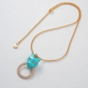 Pozłacany wisiorek z głową dużej pantery z ringiem. INSTYNKT ŁOWCZYNI