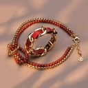 Złocona pancerka z ekoskórą w kolorze czerwonej dalii. BRIGITTE BORDO