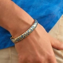 Sztywna pozłacana bransoletka z niebieskimi cętkami pantery. NIEBIESKA PANTERA