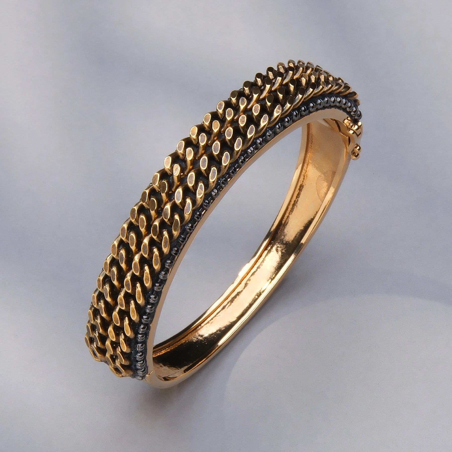 Złocona bransoletka z dekorem w formie łańcuchów. . NOWAYITALY BASTIA