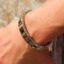 Bransoletka z inkrustowanych i pozłacanych ogniw ze stali. RUE DE RIVOLI