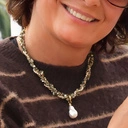 Krótki złocony naszyjnik z hematytami i perłą barokową. CABO DE SALOU