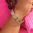 Bransoletka z inkrustowanych i pozłacanych ogniw ze stali. RUE DE RIVOLI