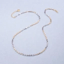 Naszyjnik z łączonych srebrnych i złotych łańcuchów. CZARNO NA BIAŁYM