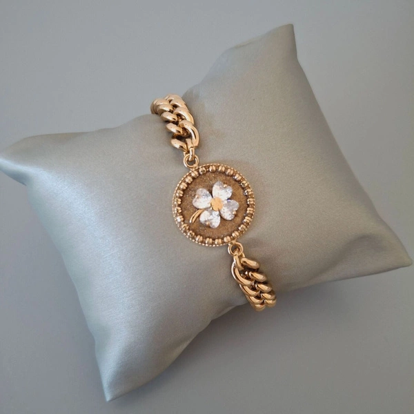 Pozłacana bransoletka z motywem kwiatka z cyrkonii. ORTE