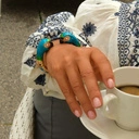 Złocona bransoletka z dwiema głowami papug z cyrkoniami. NIEROZŁĄCZKI