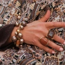 Złocony pierścień z owalnym kamieniem słonecznym. PALONY KARMEL