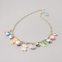 Złocony naszyjnik na łańcuchu z zabawnymi zawieszkami. SŁODKIE CUDEŃKA