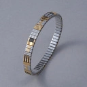 Bransoletka z inkrustowanych i pozłacanych ogniw ze stali. RUE SAINT HONORE