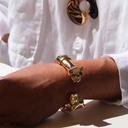 Sztywna otwarta bransoletka z dwiema głowami panter. PIĘKNO I BESTIA