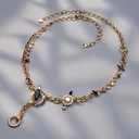 Złocony naszyjnik z białymi i czarnymi kryształkami. ZDECYDOWANA NA ZMIANĘ