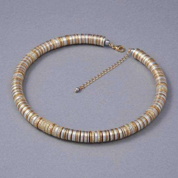 Krótki naszyjnik z pozłacanymi i posrebrzanymi krążkami. GRANDE ROUE