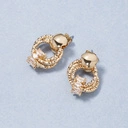 Nietypowe, pozłacane kolczyki ozdobione cyrkoniami. CHARLESTON