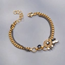 Złocona bransoletka z oczkiem z kryształami na łańcuszku. DRAPACZE CHMUR