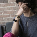 Złota bransoletka łańcuch z paskiem z czarnej ekoskóry. NOC