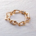 Pozłacana bransoletka z ogniw o nieregularnym kształcie. CACHACA Z LIMONKĄ