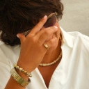 Bransoletka z inkrustowanych i pozłacanych ogniw ze stali. PHILHARMONIE